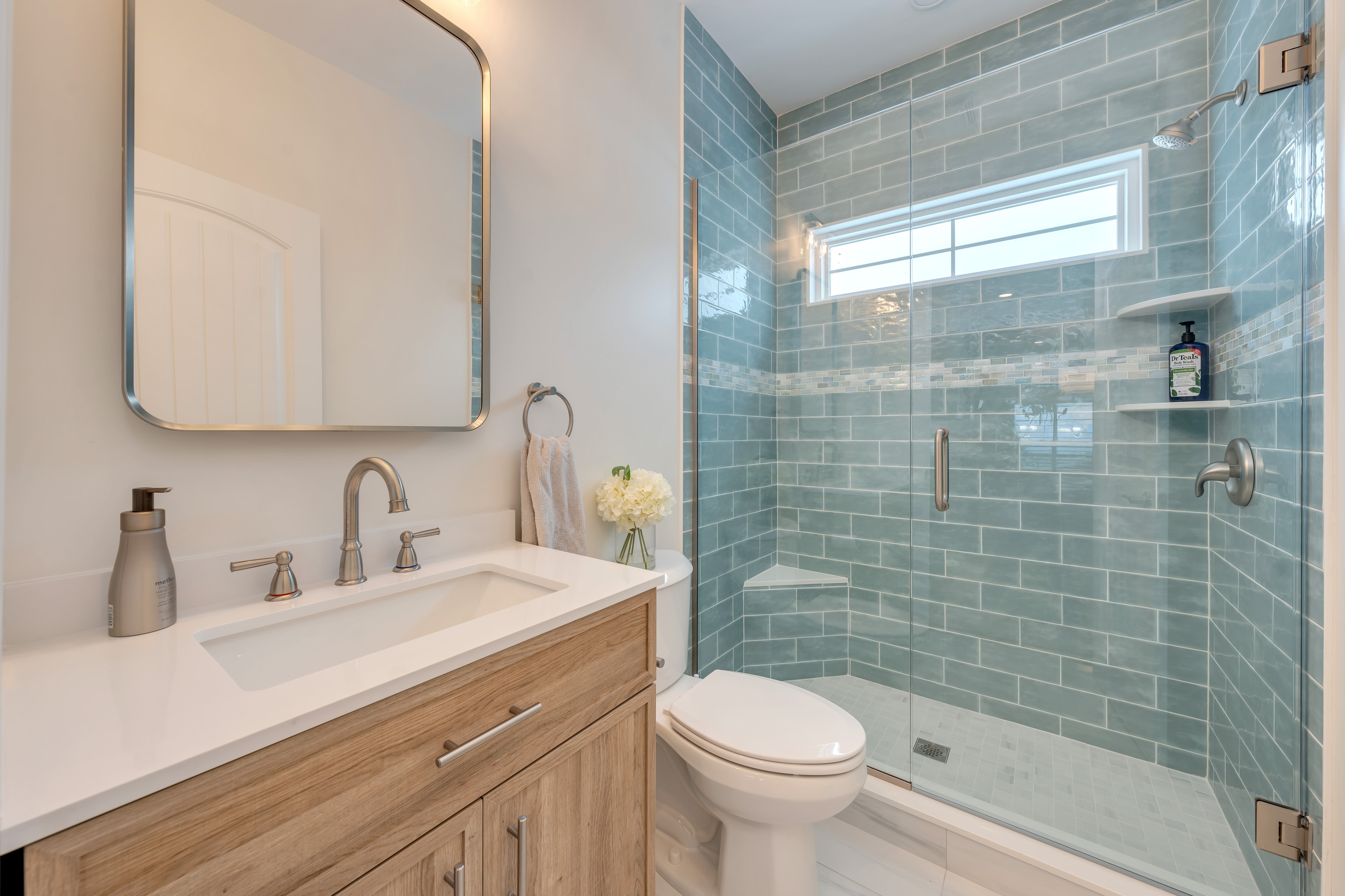 Bathroom with green tile shower